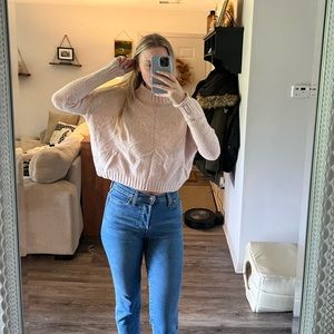 Cropped pink turtleneck sweater